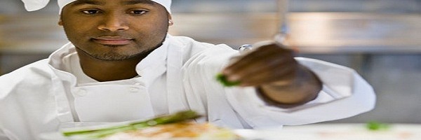 getty_rf_photo_of_chef_seasoning_dish